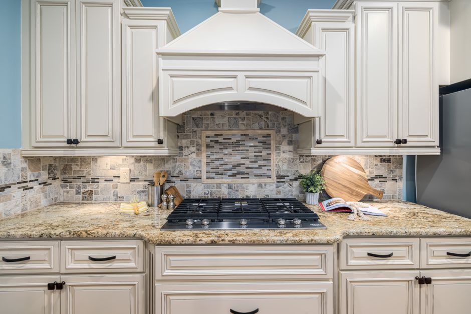 Pristine white shaker kitchen cabinets installed in a home
